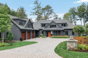 NH architectural photographer, Kerry Struble. Lake Winnipesaukee lakefront luxury home by Jason Drouin Custom Homes.