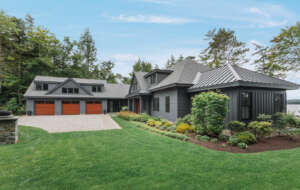 NH architectural photographer, Kerry Struble. Lake Winnipesaukee lakefront luxury home by Jason Drouin Custom Homes.