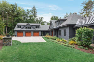 NH architectural photographer, Kerry Struble. Lake Winnipesaukee lakefront luxury home by Jason Drouin Custom Homes.