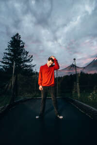 Maine highschool senior portrait by kerry struble, NH portrait artist. Dramatic trampoline senior photo session.