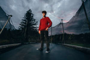 Maine highschool senior portrait by kerry struble, NH portrait artist. Dramatic trampoline senior photo session.