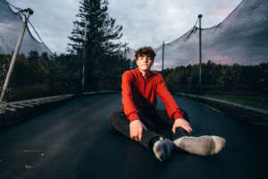 Maine highschool senior portrait by kerry struble, NH portrait artist. Dramatic trampoline senior photo session.