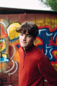 Maine highschool senior portrait by kerry struble, NH portrait artist. Colorful senior photos with graffiti background.