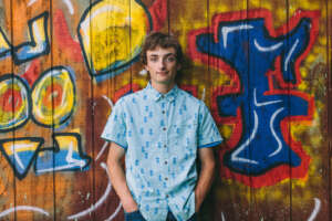 Maine highschool senior portrait by kerry struble, NH portrait artist. Colorful senior photos with graffiti background.